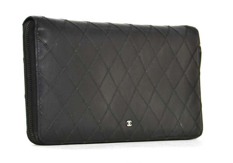 Chanel Black Quilted Leather Zip Around Travel Wallet W/Passport Holder

    Age: c. 2009-2010
    Made in Italy
    Materials: leather
    Features removable passport holder
    Opens to 10 card slots, two slip pockets and coin pocket
   