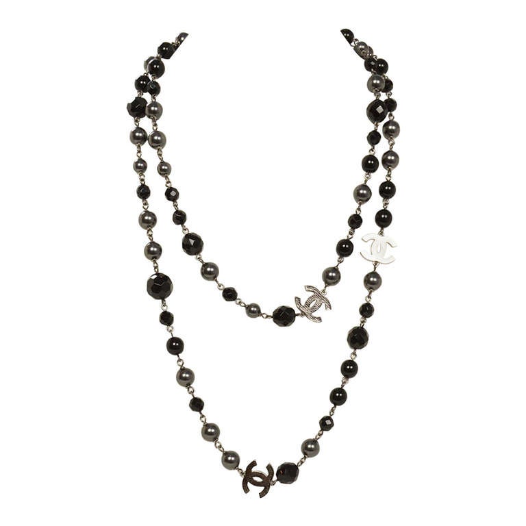 Chanel 2011 44 Long Black and Pewter Beaded Faux Pearl Chain Necklace at  1stDibs  chanel black pearl necklace, chanel black and white pearl necklace,  chanel chain pearl