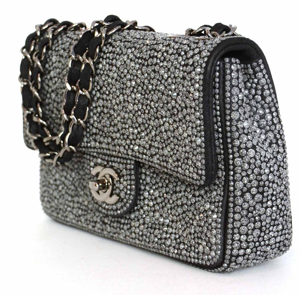 CHANEL 2014 Dark Grey Crystal Mini Flap Bag

    Made in: France
    Year of Production: 2014
    Color: Dark grey
    Hardware: Ruthenium
    Materials: Black suede backing with grey stone crystals
    Lining: Textile lining
   