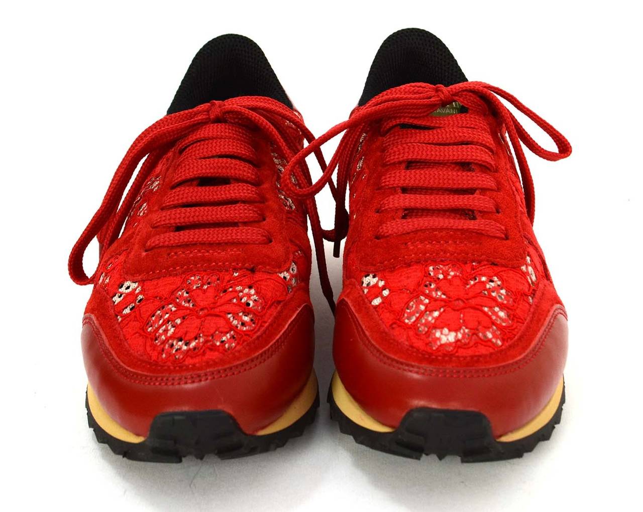 Valentino Red Suede & Lace Sneakers
Features rubber rockstuds around heel
Made in: Italy
Color: Red and tan
Composition: Suede, lace and rubber
Sole Stamp: VALENTINO GARAVANI Made in Italy
Closure/opening: Laces
Overall Condition: Excellent-
