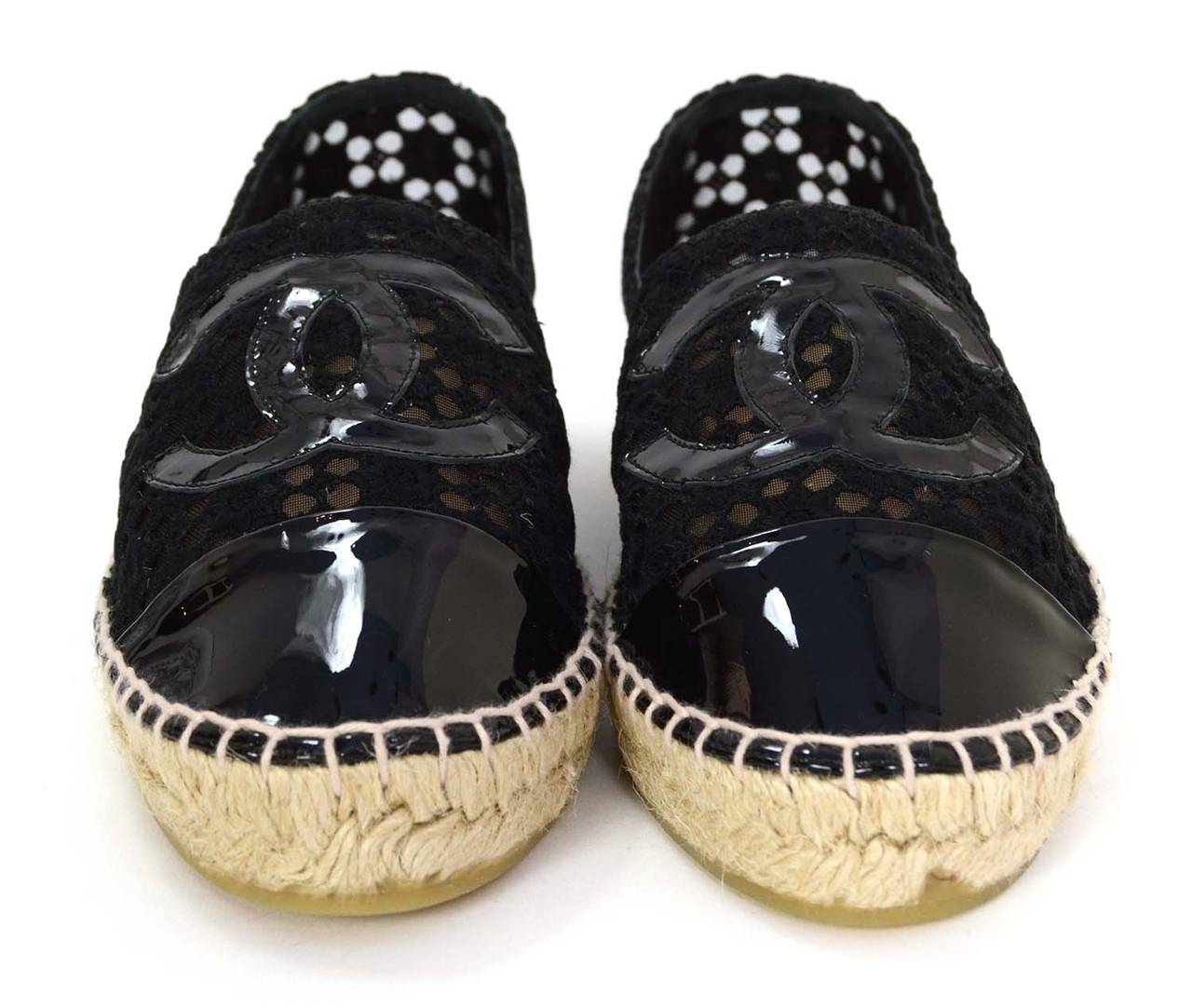 Chanel Black Mesh & Eyelet Espadrilles
Features patent toe cap and CC at front of shoe
Made in: Spain
Color: Black and beige
Composition: Mesh, eyelet, patent and jute rope
Sole Stamp: 39 Made in Spain CHANEl CC
Closure/opening: Slide