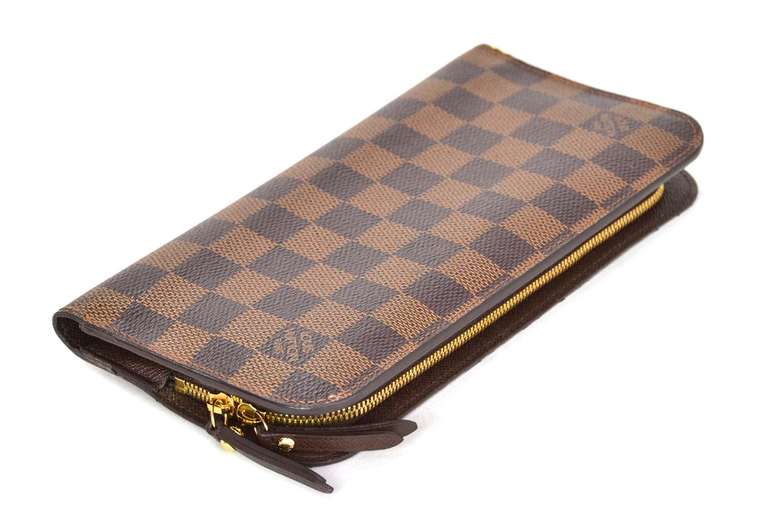 Louis Vuitton Damier Insolite Wallet Rt. $745

    Age: c. 2012
    Made in Spain
    Features two zippered pockets and two slip pockets
    Twelve card slots
    Closes with two snap buttons
    Blind date stamp: CA4172
    Stamped 