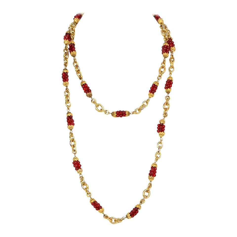 Chanel Vintage Red Bead & Gold Chain Link Necklace

Stamp: CHANEL
Closure: Jump ring closure
Color: Goldtone and red
Materials: Metal and glass
Overall Condition: Excellent with the exception of some tarnishing throughout
Measurements:
Length: