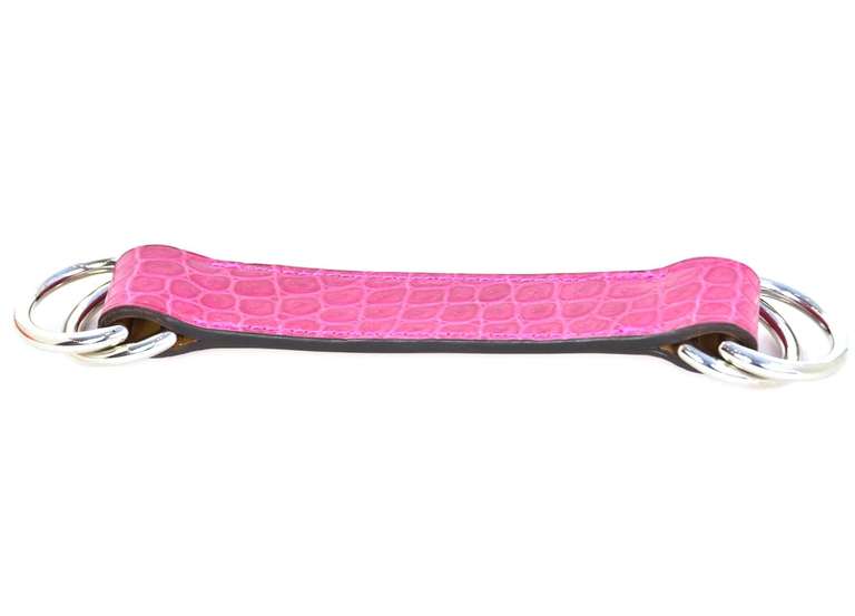 Hermes Pink Porosus Crocodile Scarf Accessory

    Age: c. 2008
    Made in France
    Materials: crocodile, silvertone metal
    Can be used as a belt,bracelet or top with scarf
Date stamp: L
    Stamped 