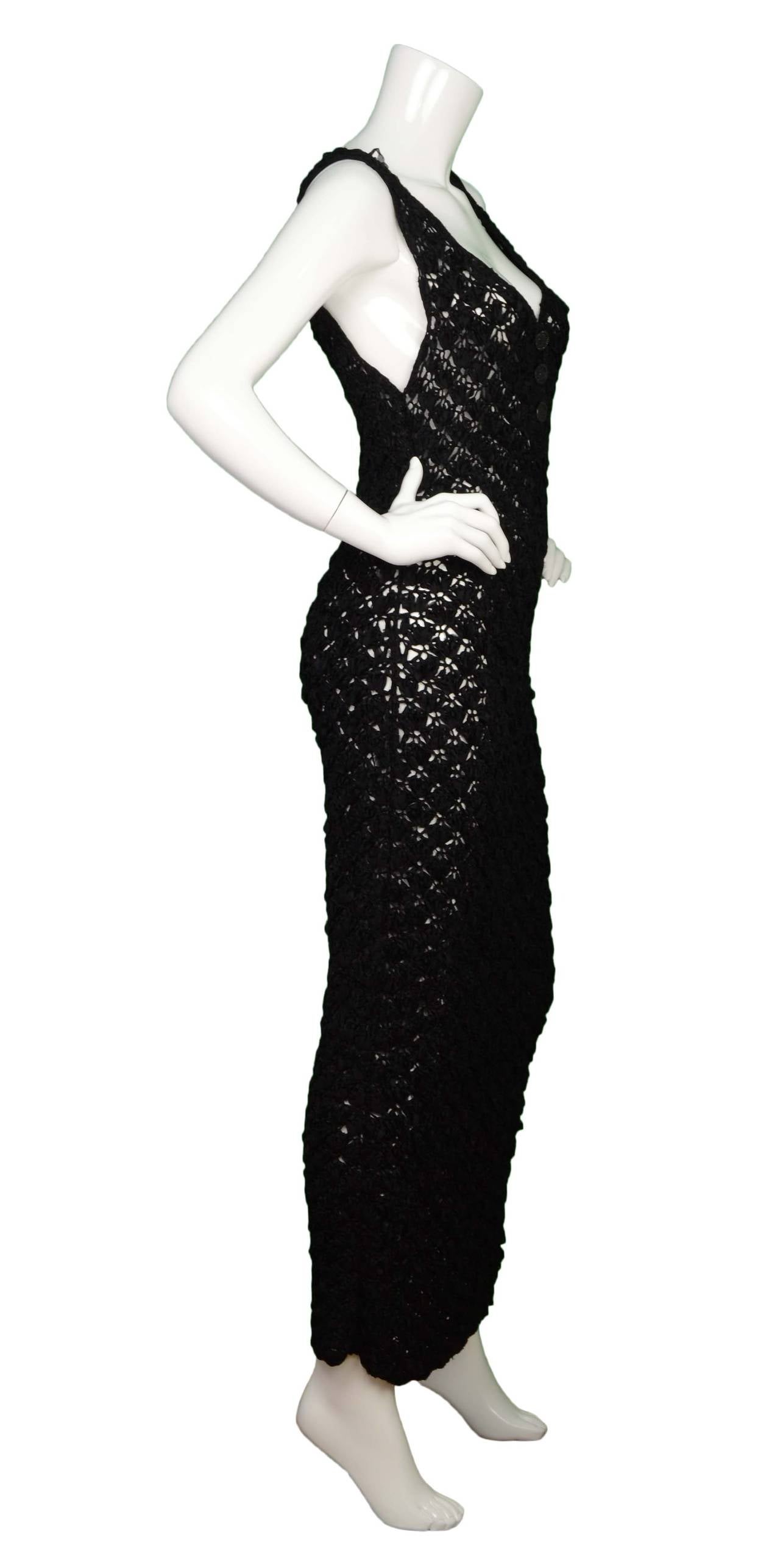 Chanel Black Ribbon Crochet Maxi Dress
Features rhinestone detailing on front buttons
Made in: Not given- believed to be France
Color: Black
Composition: Not given- believed to be silk-blend yarn
Lining: None
Closure/opening: Pull on or front