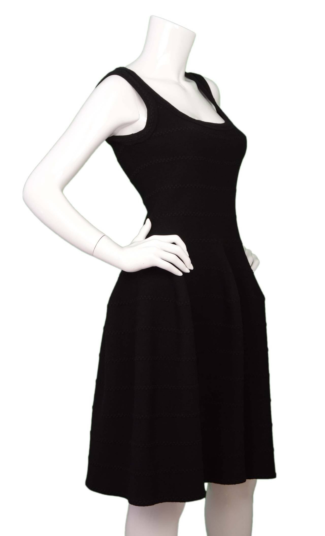 Alaia Black Knit Fit Flare Dress
Features scoop neckline and black metallic textured stripe design 

Made in: Italy
Color: Black
Composition: 45% viscose, 35% wool,15% polyester, 5% nylon
Lining: None
Closure/opening: Back center zip up
Exterior