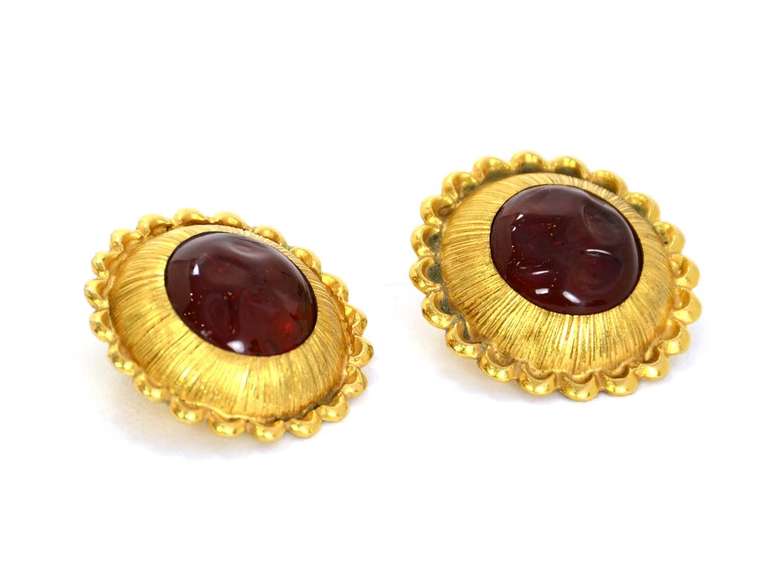 Chanel Goldtone Clip On Earrings With Red Gripoix Center Stone

    Materials: goldtone metal, gripoix
    Stamped 