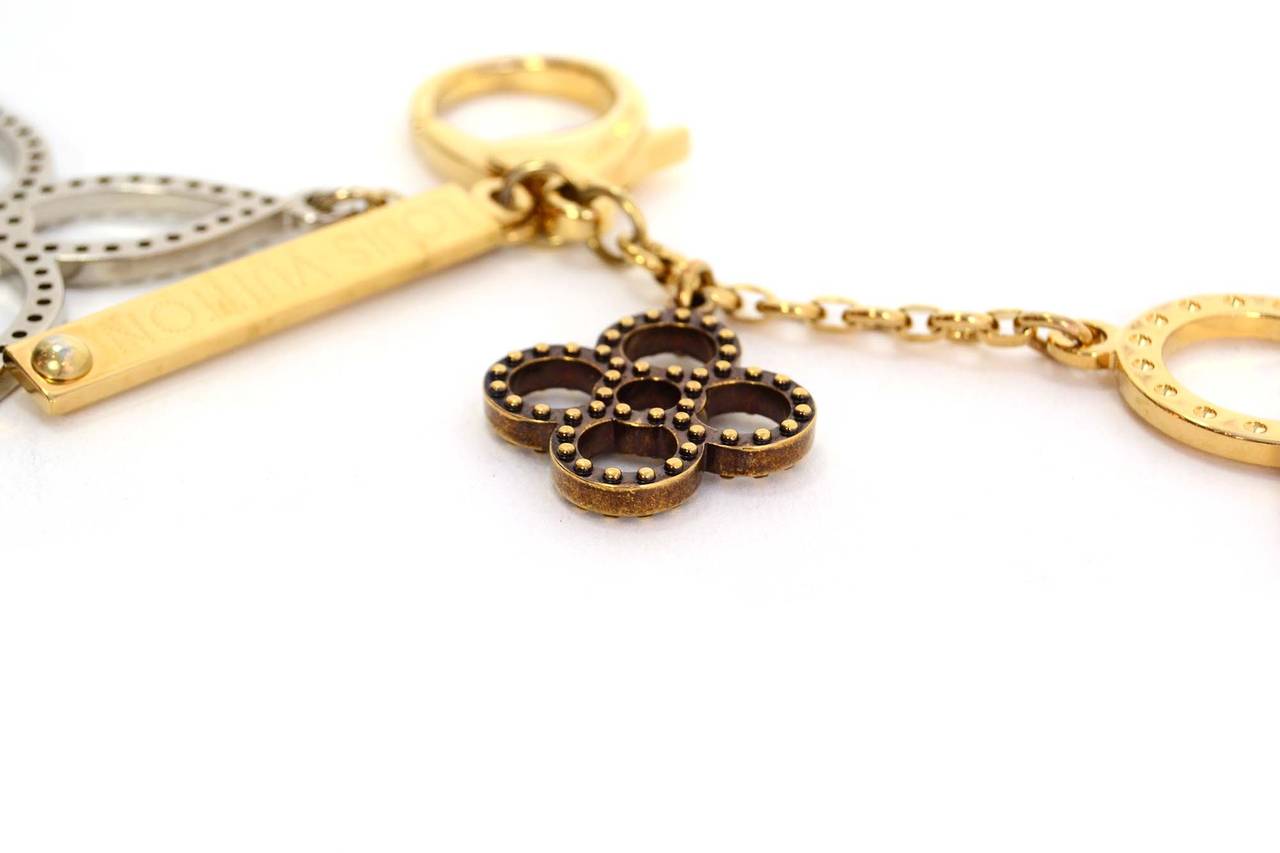 Louis Vuitton Silver & Gold Flower Bag Charm

Features four different charms
Made in: Not given- believed to be France
Year of Production: 2012
Color: Goldtone, silvertone, and bronze
Materials: Metal
Stamp: OB0152
Closure: Lobster claw