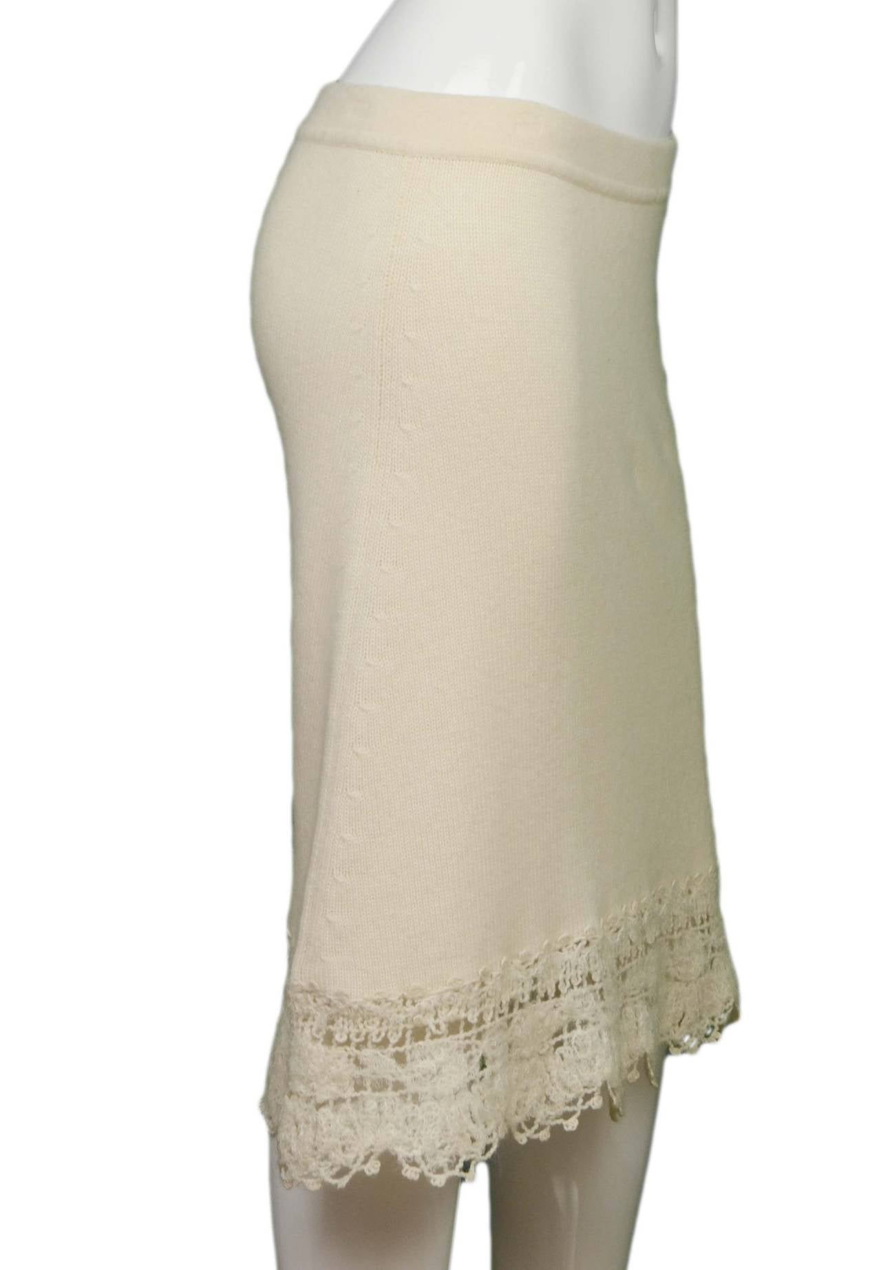 Chanel Cream Cashmere Skirt 
Features crochet trim at hemline
Made in: Italy
Year of Production: 2006
Color: Cream
Composition: 95% cashmere, 2% nylon, 2% mohair, 1% wool
Lining: None
Closure/opening: Pull on
Exterior Pockets: None
Interior