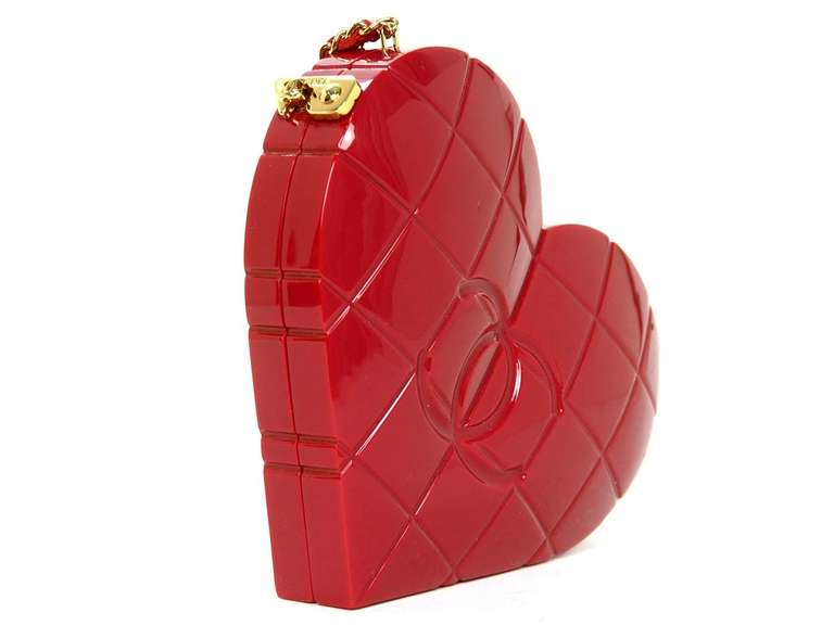 This rare Chanel heart clutch is the perfect accessory for any outfit! Also great for the Chanel collector who has everything.

Made in Italy circa 2002
Made of red resin exterior with red leather lining
Features heart shape with square quilting