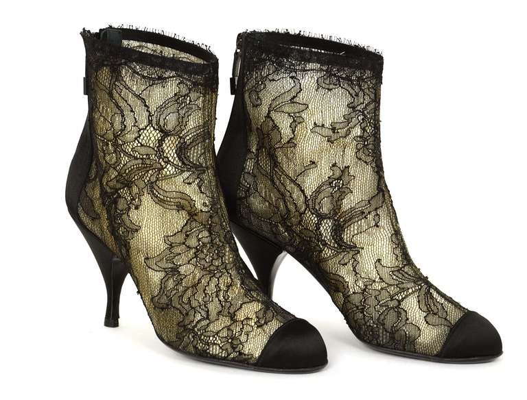 Chanel Black Lace Ankle Boot W//Satin Trim Sz 38

    Made in Italy
    Materials: lace, satin
    Back zipper closure
    Stamped 