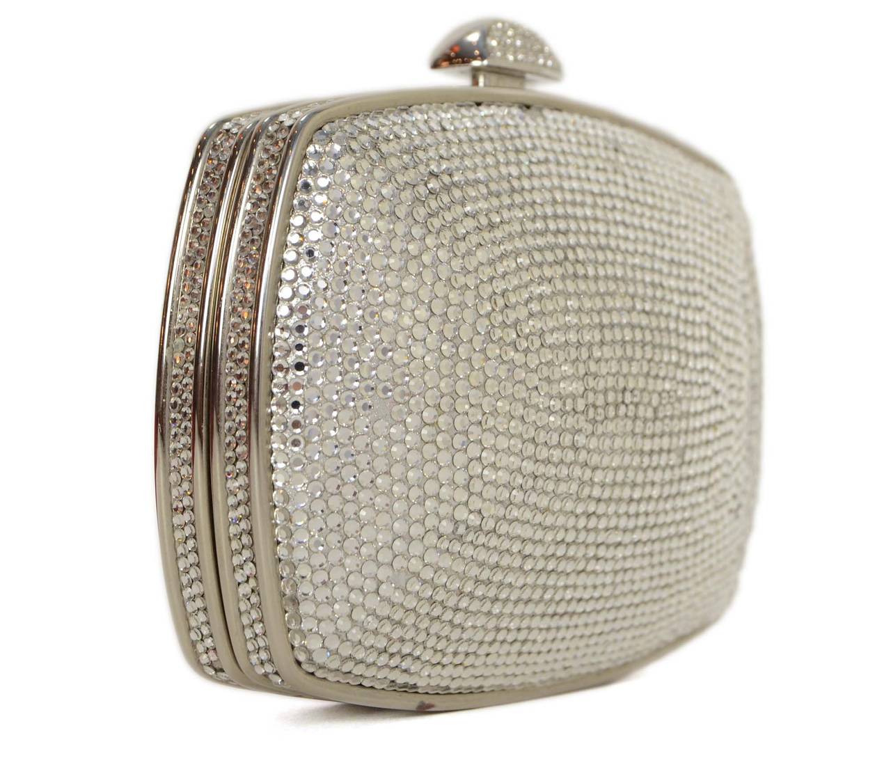 Judith Leiber Silver & Crystal Minaudiere Small Clutch
Features silvertone thin shoulder strap that can be hidden away or used for a shoulder bag
Made in: Not given
Color: Silver
Hardware: Silvertone
Materials: Metal and crystals
Lining: