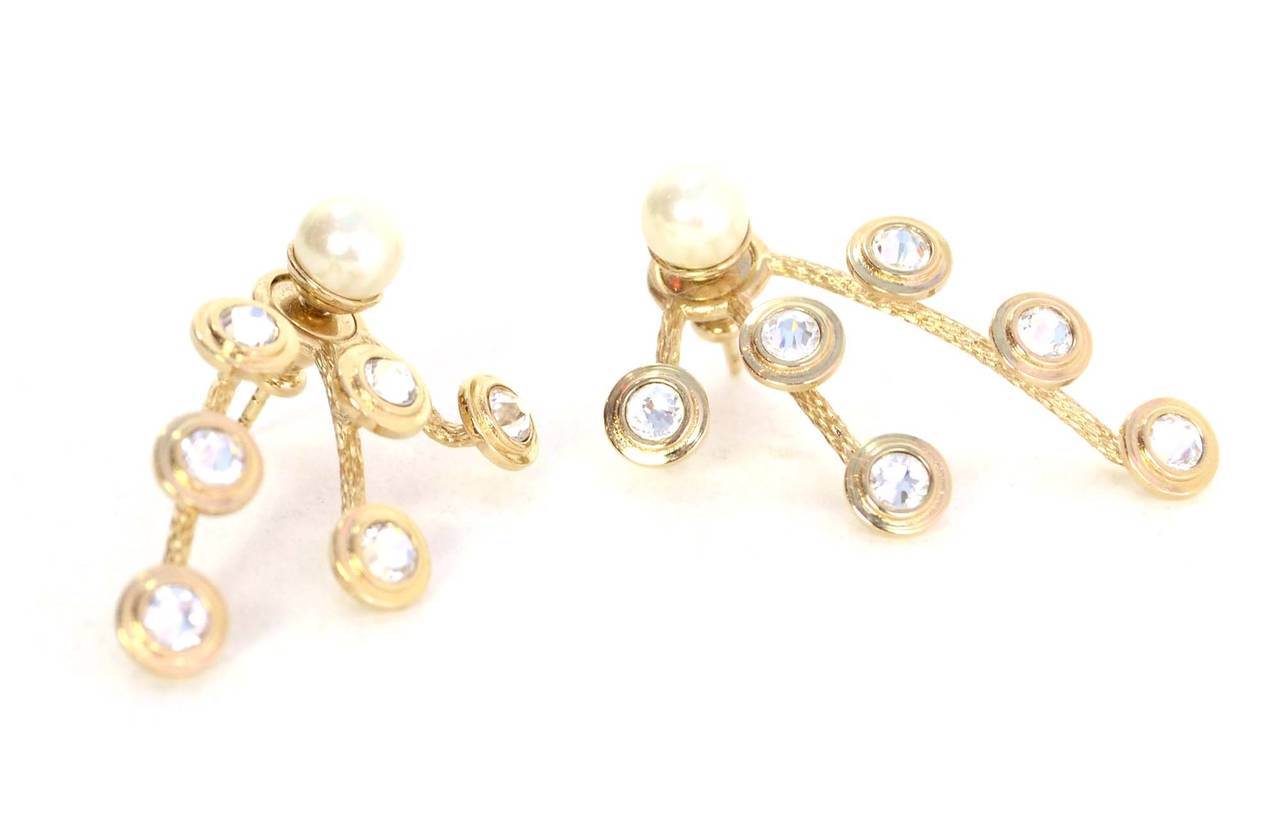 Christian Dior Mise En Dior Pearl & Crystal Earrings
Made in: Not given
Stamp: Dior
Closure: Pierced back closure
Color: Ivory and silvertone
Materials: Metal, faux pearls and crystal
Overall Condition: Excellent condition
Includes: Christian