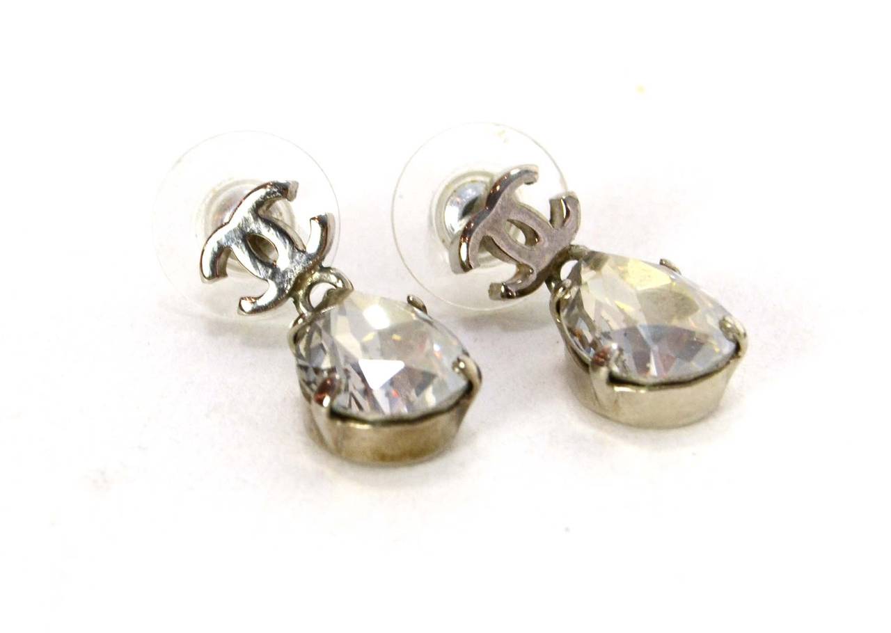 Chanel Crystal & Silver CC Tear Drop Earrings
Made in: Not given
Stamp: Missing date stamp
Closure: Pierced back
Color: Silvertone
Materials: Metal and crystal
Overall Condition: Excellent with the exception of missing date