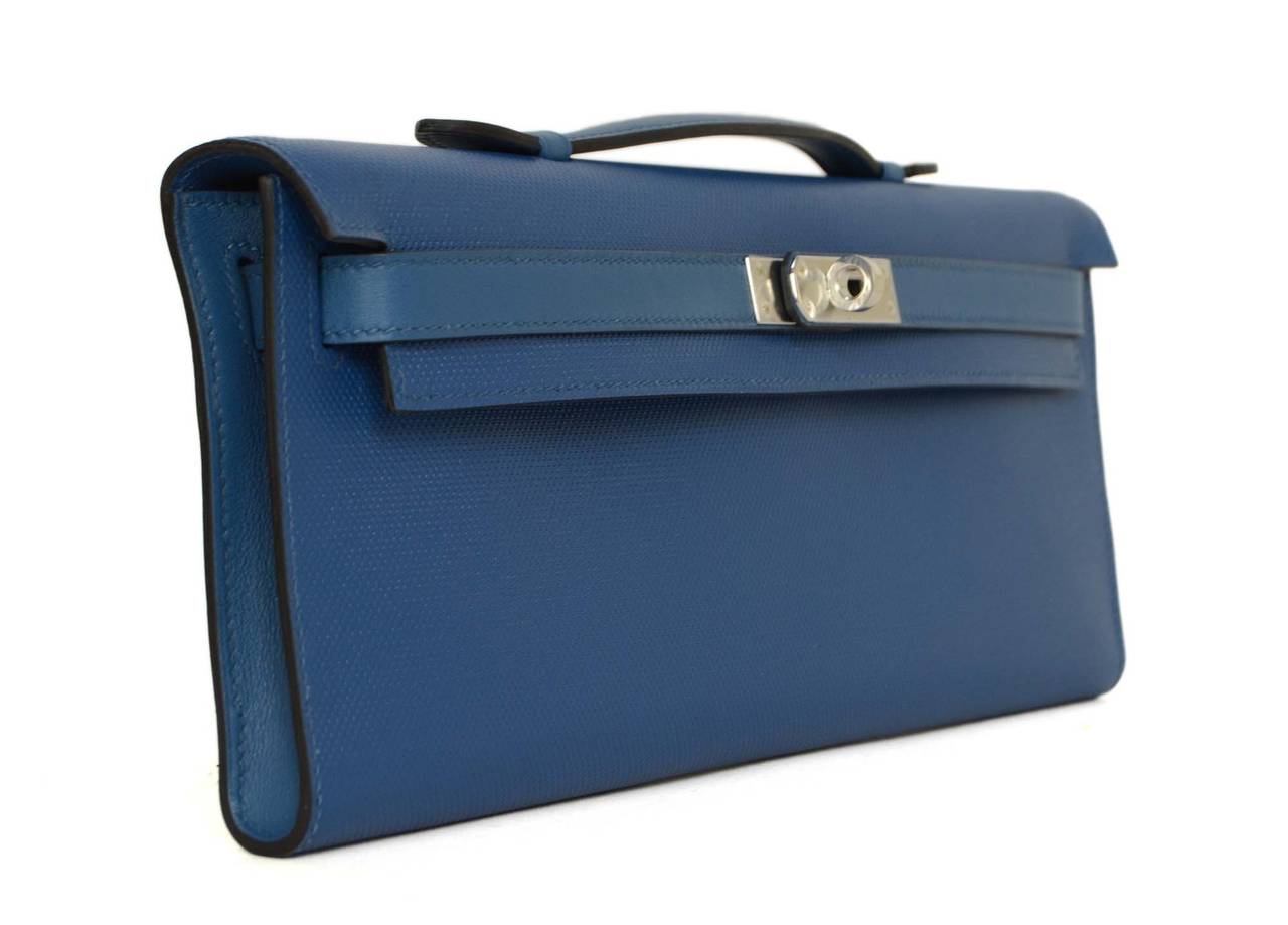 Hermes Bleu de Galice Grain d'H Leather Kelly Cut Bag
Made in: France
Year of Production: 2014
Color: Bleu de Galice and silvertone
Hardware: Palladium
Materials: Grain d'H calfskin leather (processed male calf leather that features a finely