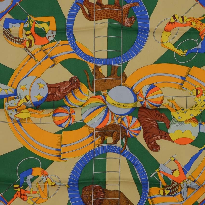 Hermes Coral & Blue Circus 70cm Silk Scarf
Features Circus acts and animals printed throughout
Made in: France
Color: Coral, blue, grey, orange, breen and yellow
Composition: 100% silk
Overall Condition: Excellent condition
Includes: Hermes