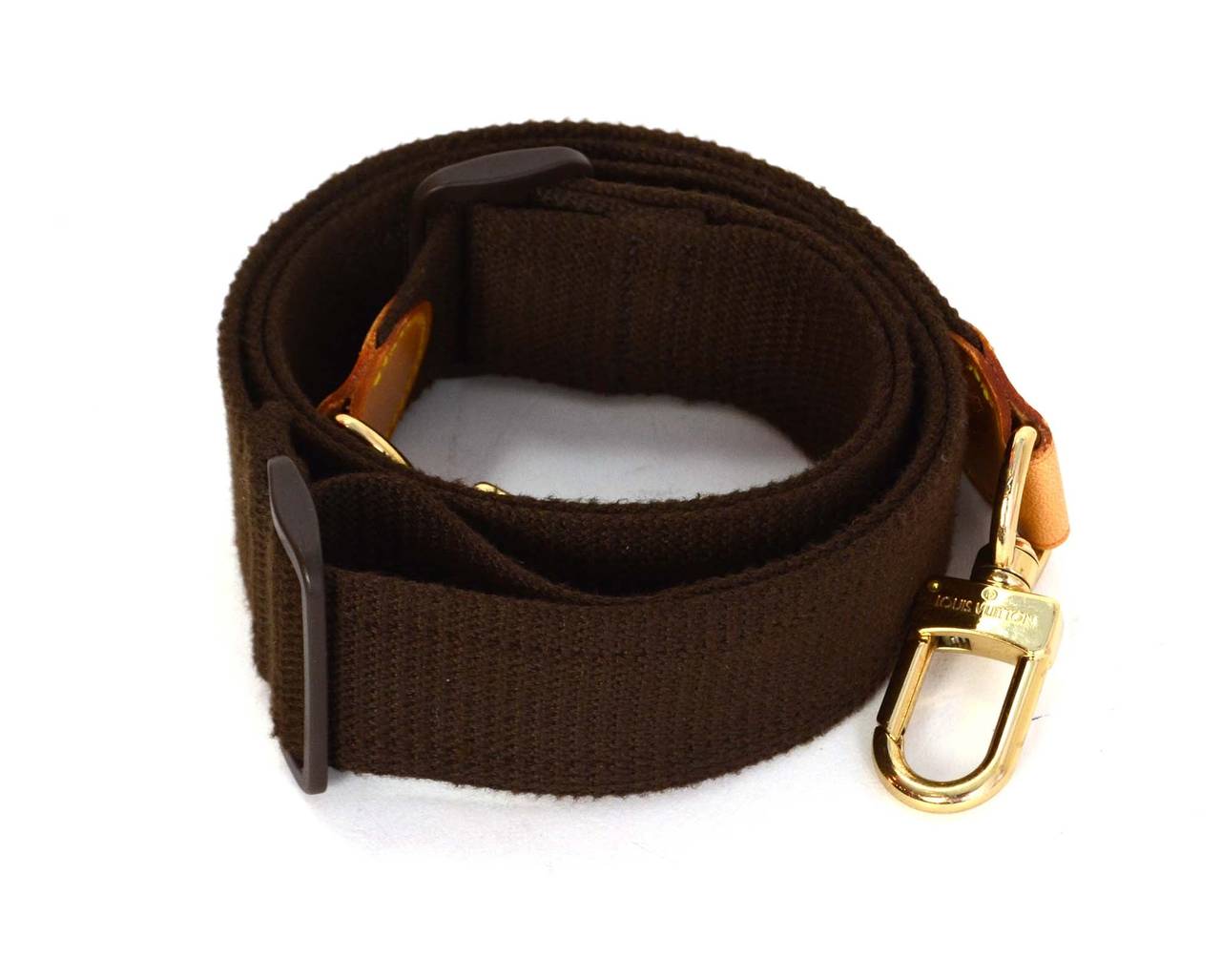 Louis Vuitton Brown Canvas Keepall Bag Strap
Features sliding buckle to extend or retract to varying lengths
Made in: France
Color: Brown, tan and goldtone
Hardware: Goldtone
Materials: Canvas, leather and metal
Closure/opening: Two gold tone