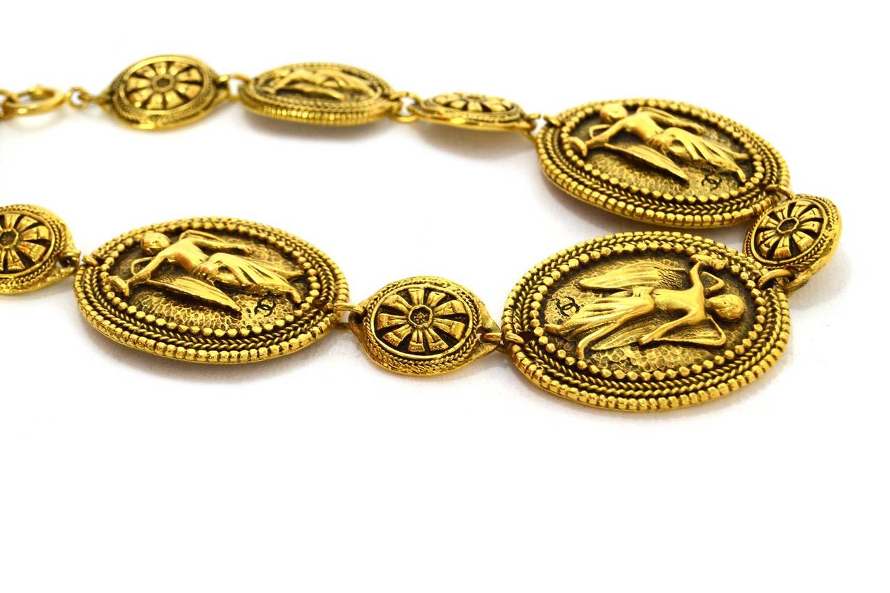 Chanel Vintage Gold Medallion Choker Necklace
Features different angels on two larger medallions and flowers on small medallions
Stamp: Missing date stamp
Closure: Jump ring closure
Color: Goldtone
Materials: Metal
Overall Condition: Excellent