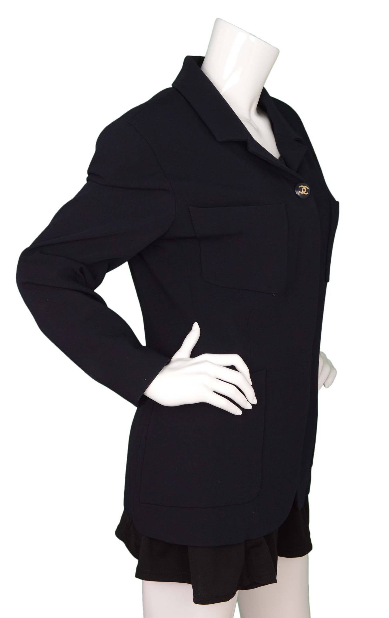 Chanel Navy Single-Breasted Jacket 
Features navy resin and silvertone CC buttons
Made in: France
Color: Navy
Composition: Not given- believed to be a wool blend
Lining: Navy, believed to be 100% silk
Closure/opening: Front and center button