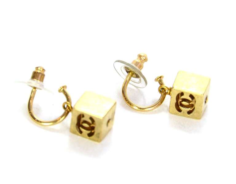 Chanel Goldtone CC Pierced Cube Earrings

    Age: c.2002
    Made in France
    Materials: goldtone metal
    Hanging cube with CC on two sides
    Stamped 