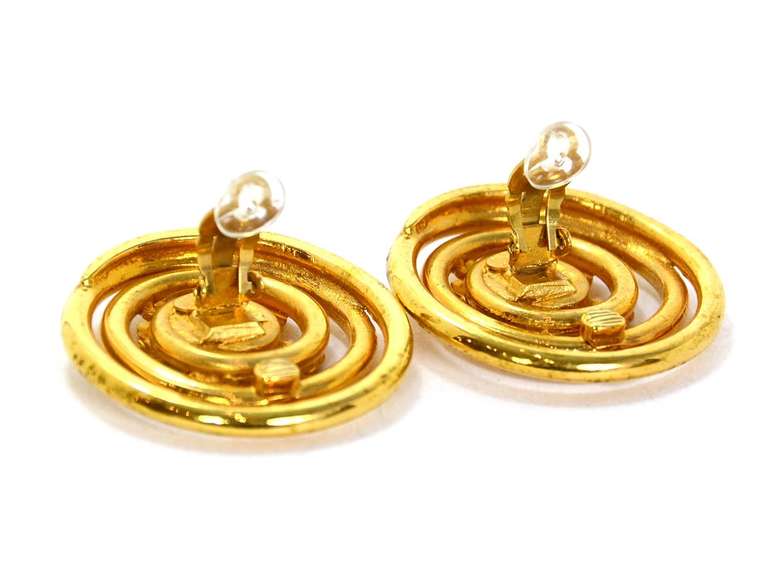 Chanel Vintage '93 Extra Large Swirl Clip On Earrings

Made In: France
Year of Production: 1993
Stamp: 93 CC A
Closure: Clip on earrings
Color: Goldtone
Materials: Metal
Overall Condition: Excellent pre-owned condition with some light surface