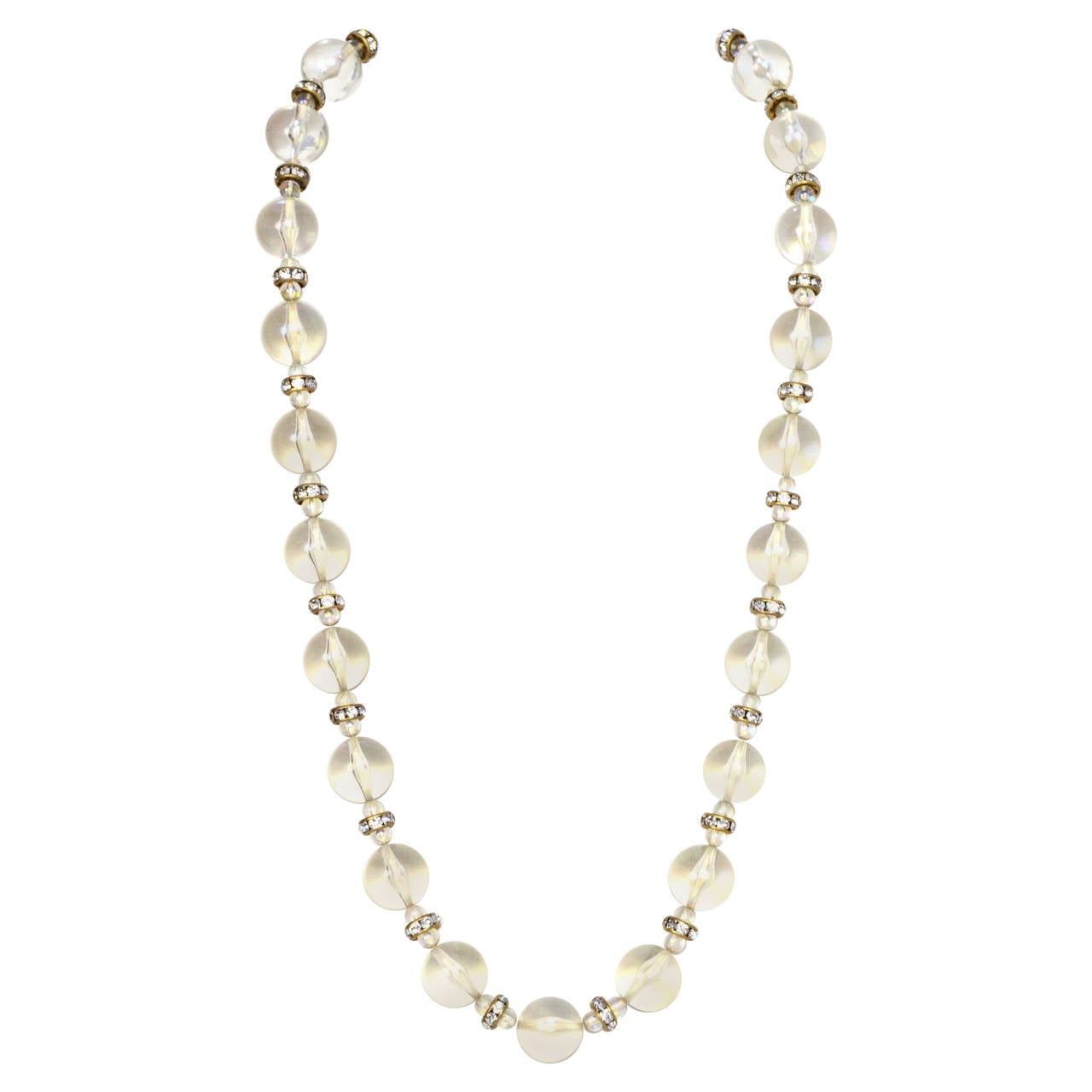 Chanel Vintage '88 Clear Bead & Crystal Necklace

Made in: France
Year of Production: 1988
Stamp: 2 CC 8
Closure: None
Color: Goldtone
Materials: Resin, rhinestones and metal
Overall Condition: Excellent with the exception of tarnishing throughout