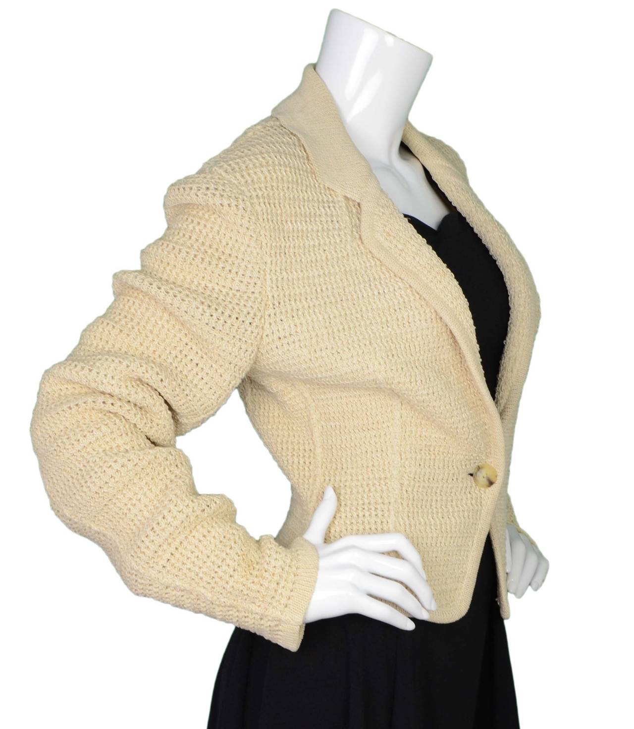 Alaia Beige Knit Dolman Sleeve Cropped Cardigan
Made in: Italy
Color: Beige
Composition: 85% linen and 15% spandex
Lining: None
Closure/opening: Front center single button closure
Exterior Pockets: None
Interior Pockets: None
Overall