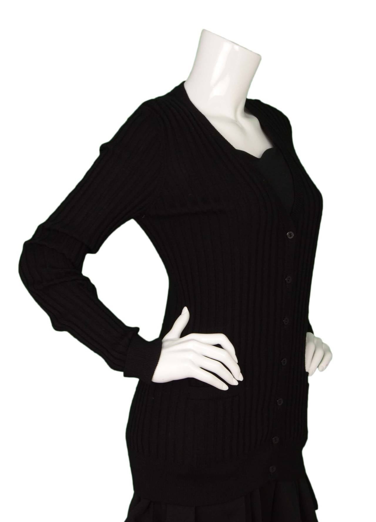 Dolce & Gabbana Black Ribbed Cashmere Cardigan
Features small tag on hip with nylon fabric over it reading 