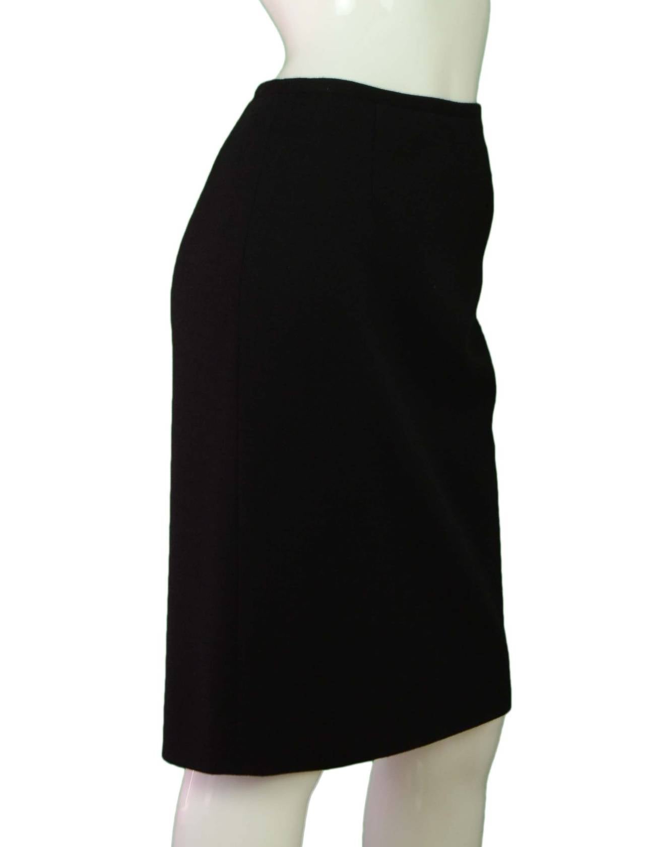 Hermes Black Wool Pencil Skirt
Made in: Italy
Color: Black
Composition: 100% wool
Lining: Black, 100% silk
Closure/opening: Back center zipper and button eye closure
Exterior Pockets: None
Interior Pockets: None
Overall Condition: Excellent