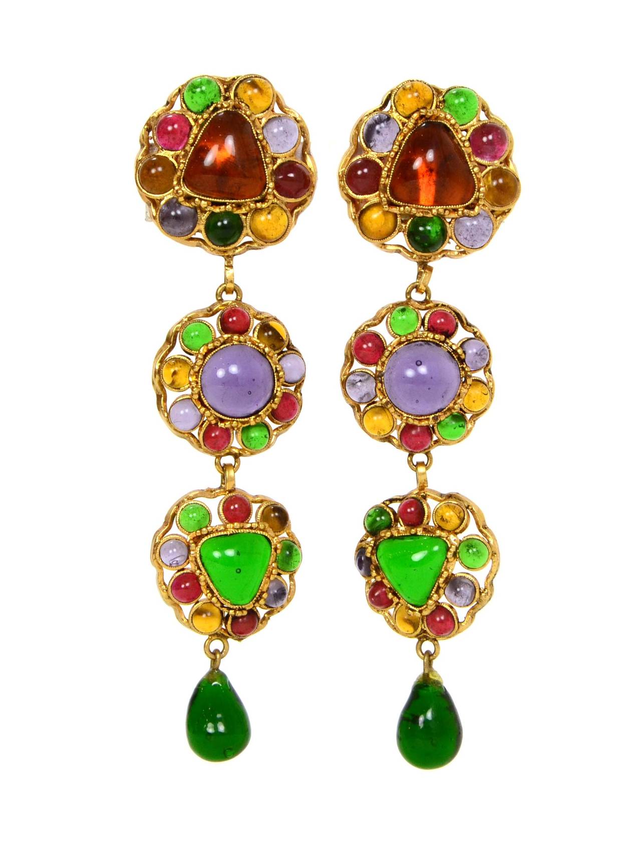 Chanel Vintage 80's Multi Color Gripoix Drop Clip On Earrings
Features three tiers and tearr drop pendant at bottom
Made in: France
Year of Production: 1987
Stamp: 2 CC 5
Closure: Clip on
Color: Orange, pink, purple, green and