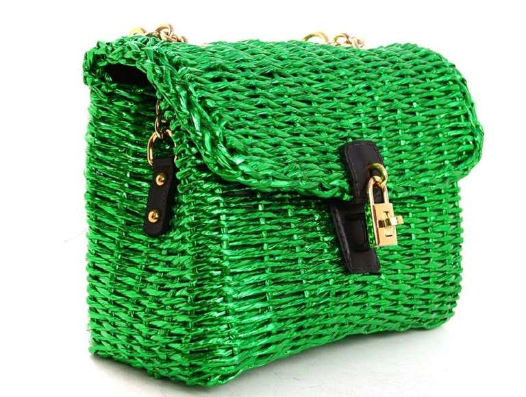 Metallic neon green woven raffia
Leopard print lining with zippered pocket
Padlock twist closure
Removable and adjustable strap

Can be carried by top handle or on shoulder
Stamped 