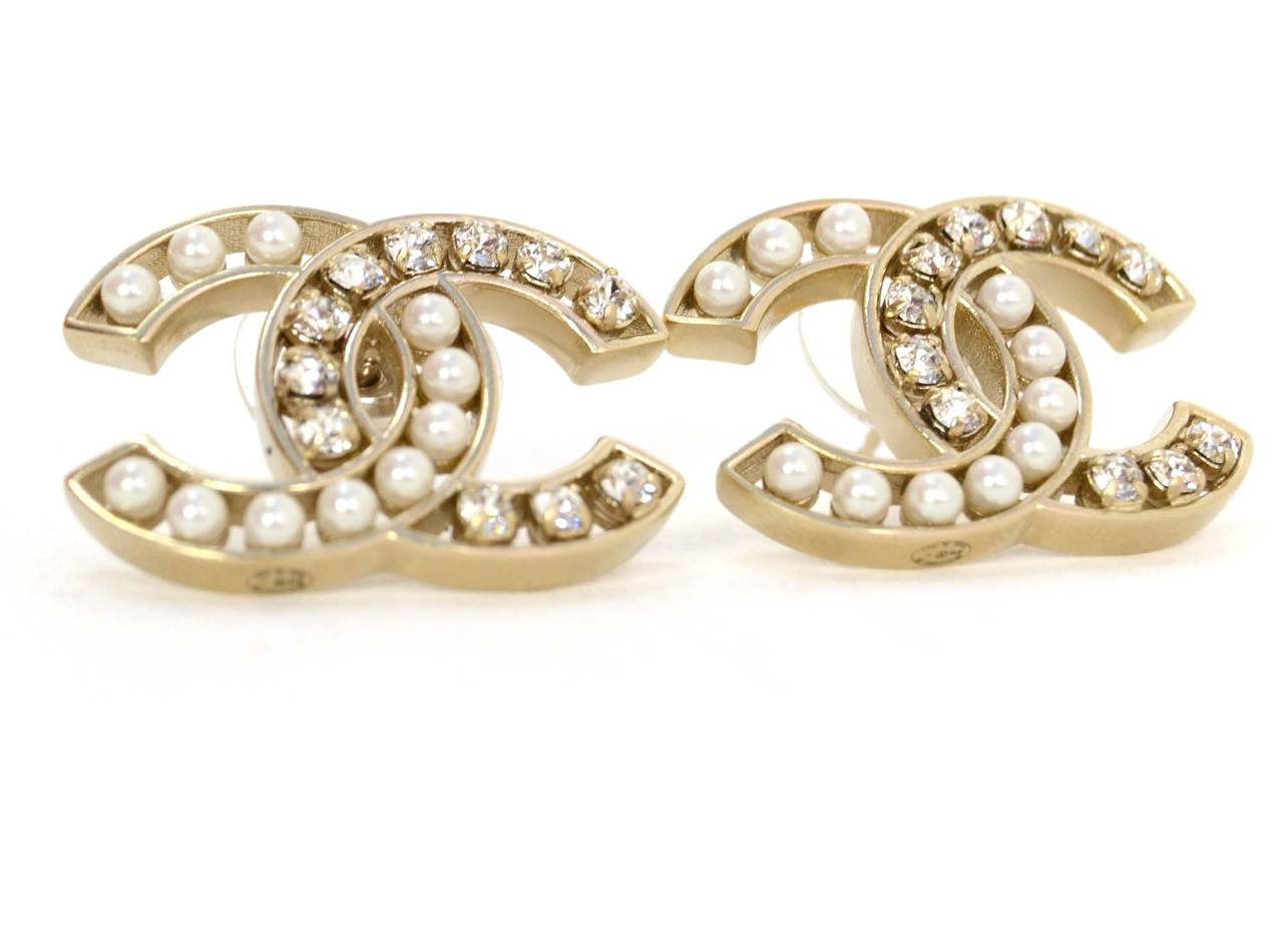 Chanel '15 Pearl & Crystal CC Stud Earrings
Made in: Italy
Year of Production: 2015
Stamp: B15 CC V
Closure: Pierced back closure
Color: Silvertone and ivory
Materials: Metal, faux pearls and crystal
Overall Condition: Excellent- like