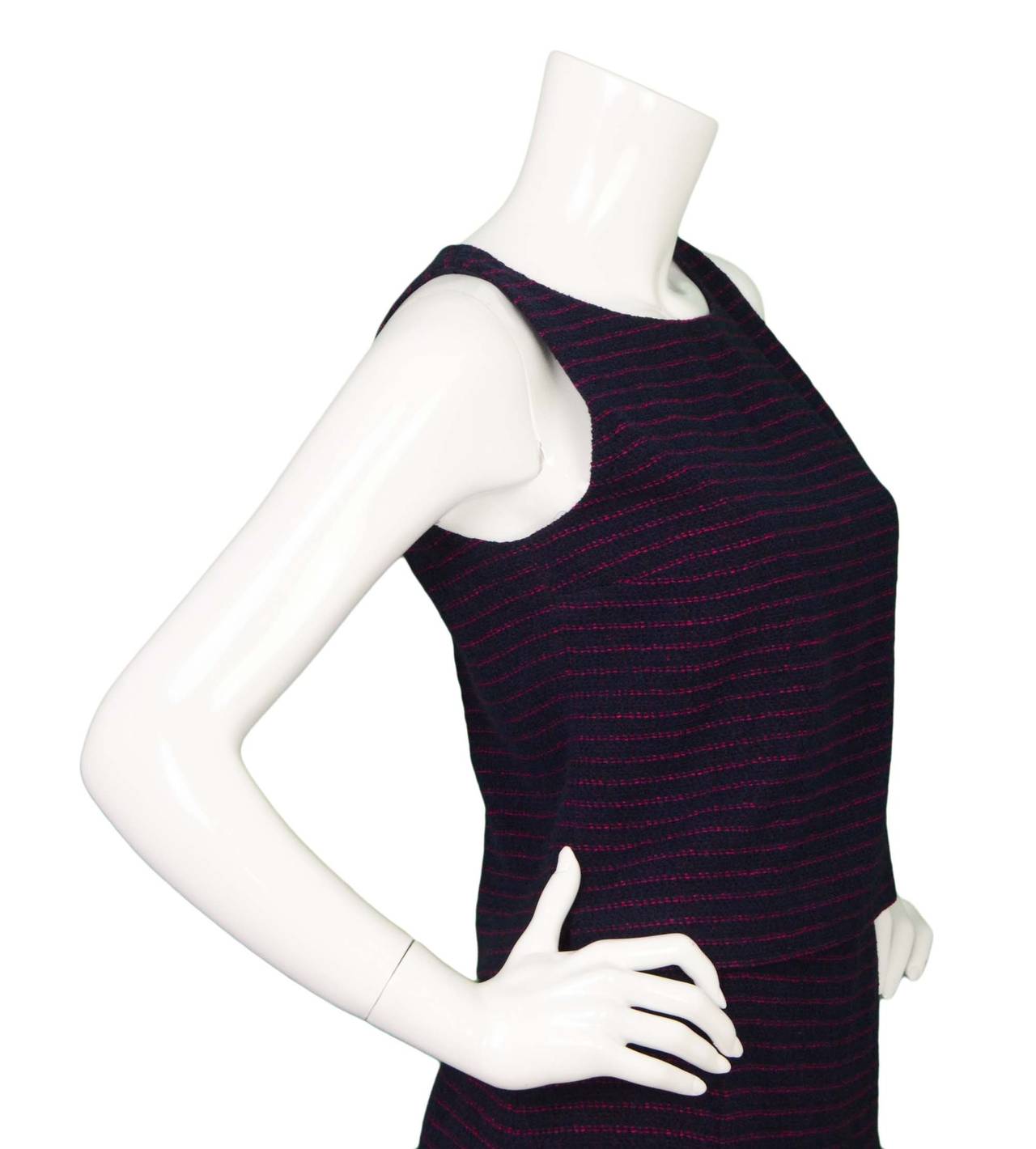 Chanel Vintage '98 Navy & Pink Striped Tweed Shell Top
Features two small slits on side for slight flare effect
Made in: France
Year of Production: 1998
Color: Navy and pink
Composition: 95% wool, 5% nylon
Lining: Navy, 95% silk, 5%