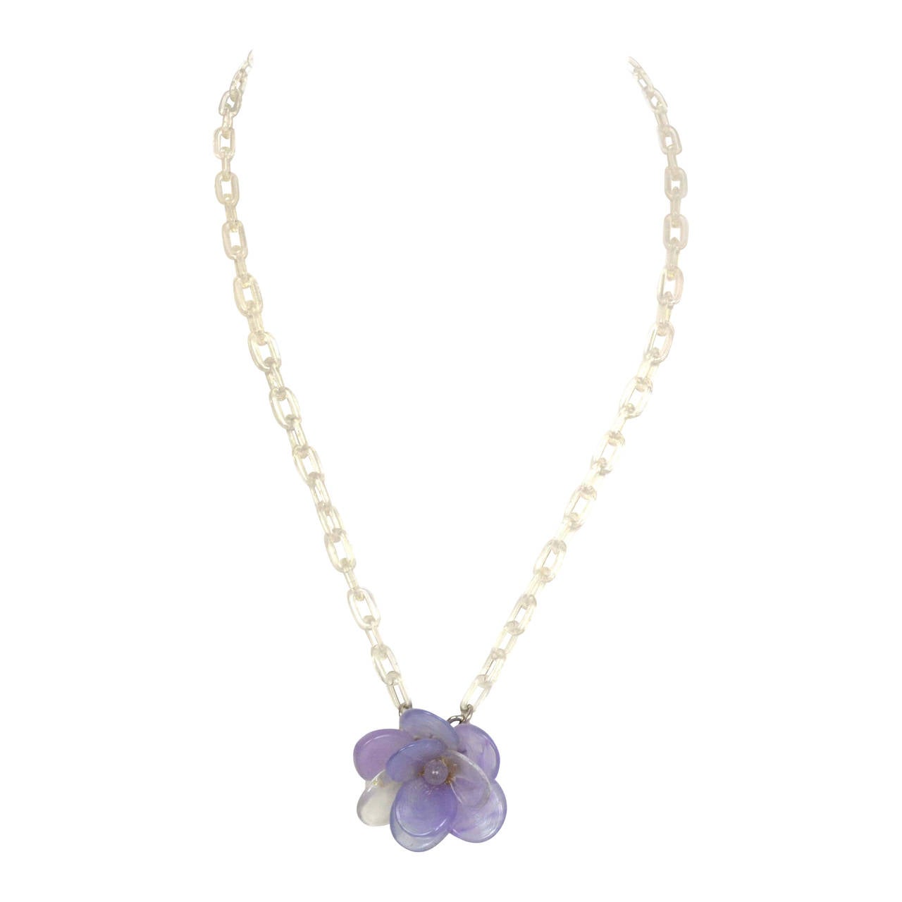 Chanel Lavender Glass Flower & Clear Resin Chain Link Necklace
Features large clear resin CC pendant at back neck closure
Made in: France
Year of Production: 2001
Stamp: 01 CC P
Closure: Hook Closure
Color: Lavender and