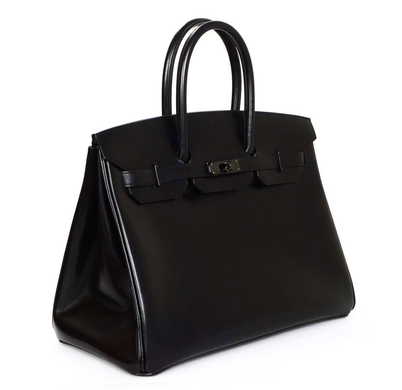 Hermes Rare Black Box Leather SO BLACK 35 cm Birkin Bag

    Made in: France
    Year of Production: 2011
    Color: Black
    Hardware: Black
    Materials: Box leather and metal
    Lining: Box leather
    Closure/opening: Top flap with