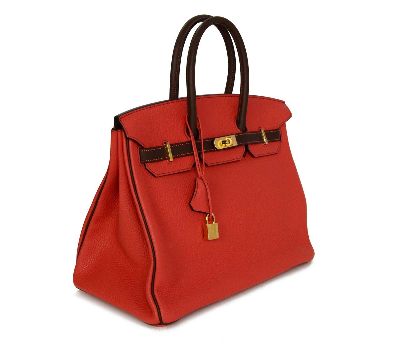 Hermes Rouge Pivione/Cacao Red & Brown Togo Leather 35 cm Birkin Bag
*NOTE: Horseshoe stamp next to Hermes logo indicates special order color*

    Made in: France
    Year of Production: 2015
    Color: Red, brown, and goldtone
    Hardware: