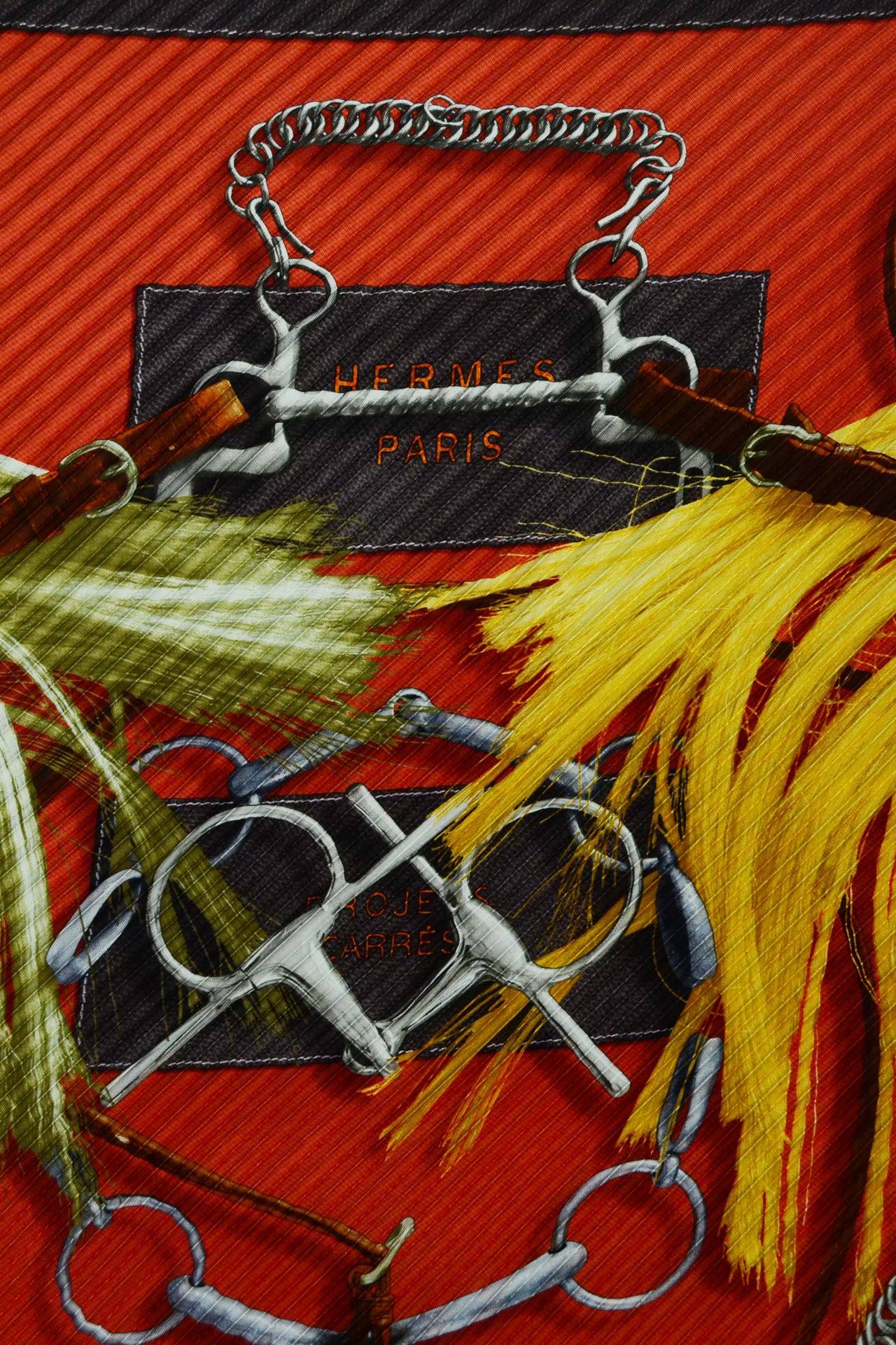 Hermes Burnt Orange Equestrian Themed Silk Pleaty Scarf
    Made in: France
    Color: Burnt orange, brown, yellow, tan
    Composition: Silk
    Overall Condition: Excellent with no visible signs of wear
Measurements:
Length: 53.5