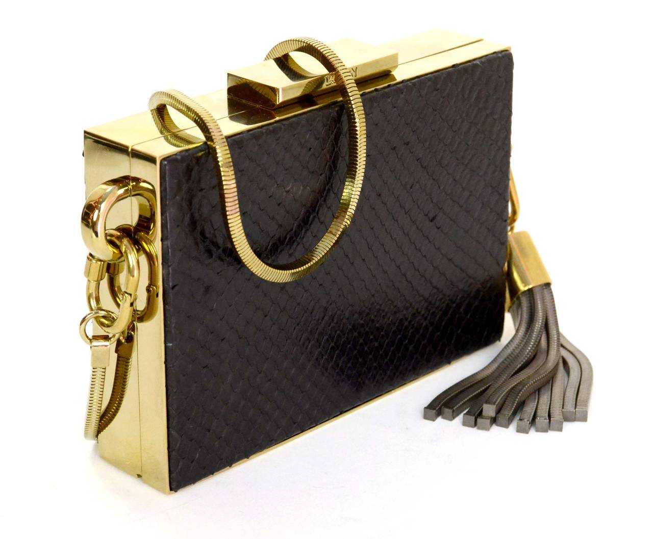 Lanvin Black Python Minaudiere Evening Bag
Features Lanvin tassel charm with hanging chain links and removable gold chain strap

    Made in: Italy
    Color: Black and goldtone
    Hardware: Goldtone
    Materials: Python skin, suede, and