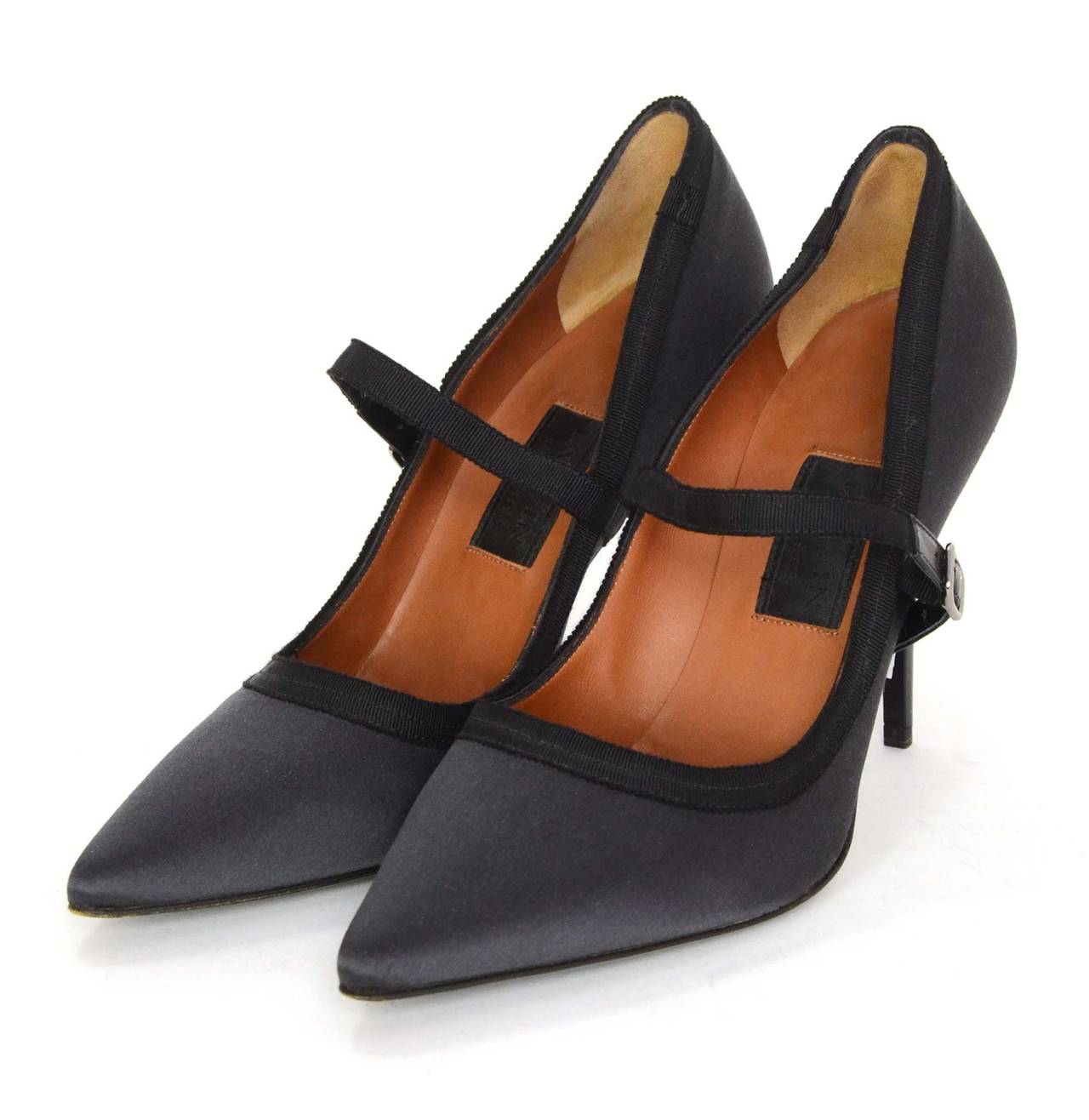 Lanvin Grey Satin Mary-Jane Pumps
Features black trim
Made in: Italy
Color: Grey and black
Composition: Satin
Sole Stamp: Vero Cuoio Made in Italy 38 1/2
Closure/opening: Slide on with mary-jane strap and buckle
Overall Condition: Excellent