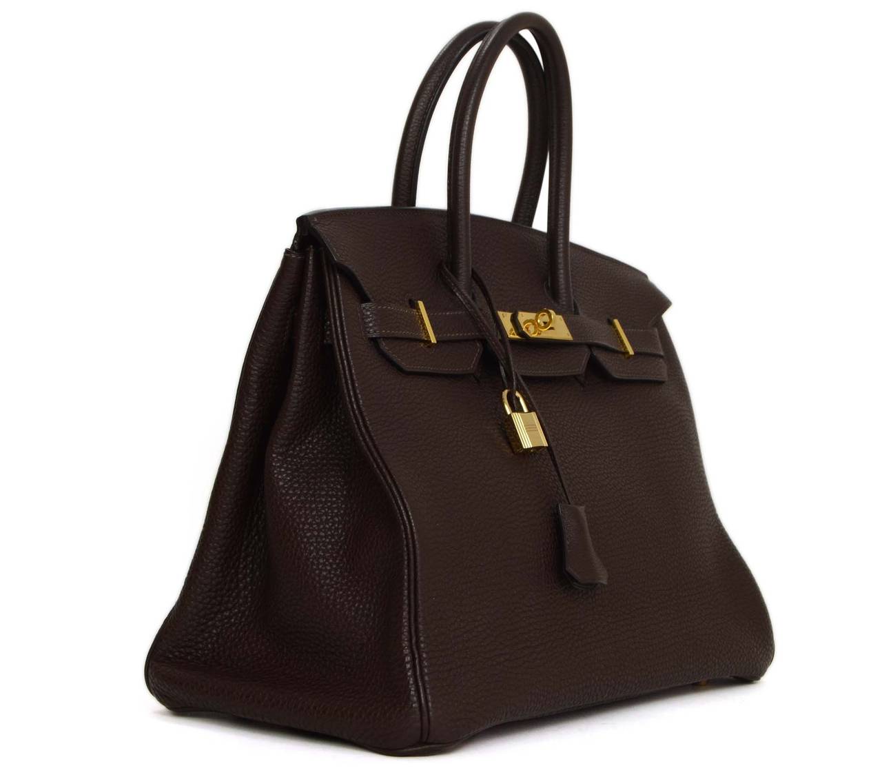 Hermes Brown Togo Leather 35cm Birkin Bag
Features double rolled leather handles
Made in: France
Year of Production: 2003
Color: Brown and goldtone
Hardware: Gold plated
Materials: Togo leather
Lining: Brown, chevre leather
Closure/opening: