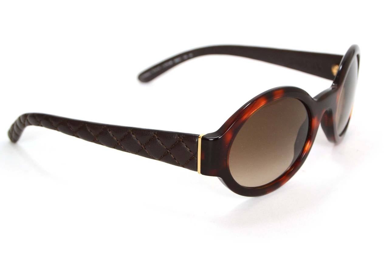 Chanel Tortoise Shell & Quilted Leather Round Sunglasses
Features brown quilted leather arms
Made in: Italy
Stamp: BC3432815
Color: Brown and tortoise shell
Materials: Resin and leather
Overall Condition: Excellent pre-owned condition with the