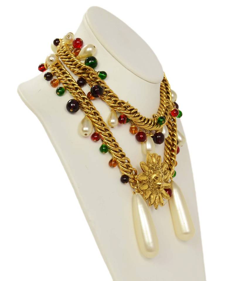 Chanel Vintage Necklace/Belt with Lion Head Sun
Goldtone chain belt with multicolor (purple, green, red, amber) gripoix beads as well as faux pearl bead charms.  
Lion head sun is the center piece of this belt/necklace with large pearl drops