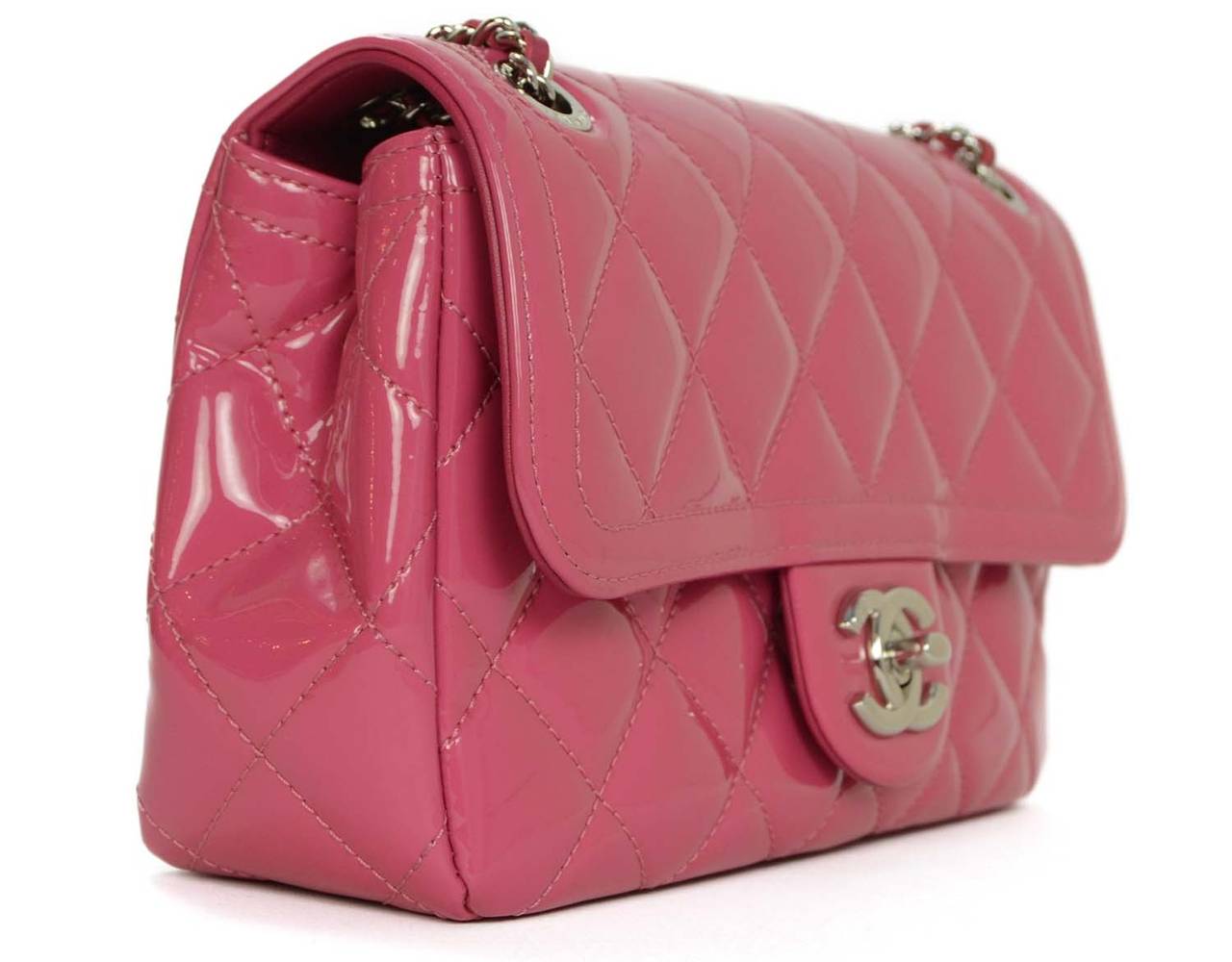 Chanel '15 Pink Quilted Patent Small Flap Bag
Features adjustable shoulder strap
Made in: Italy
Year of Production: 2015
Color: Pink
Hardware: Silvertone
Materials: Patent leather
Lining: Black canvas
Closure/opening: Flap top with CC twist