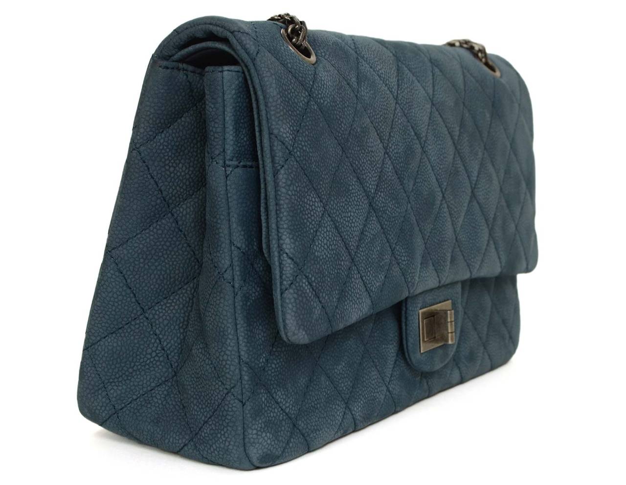 Chanel Iridescent Blue Quilted Caviar 2.55 Re-Issue 227 Double Flap Bag
Features mademoiselle chain strap and re-issue rectangular twist lock with CHANEL engraved.
Made in: France
Year of Production: 2013
Color: Blue
Hardware: Oxidized