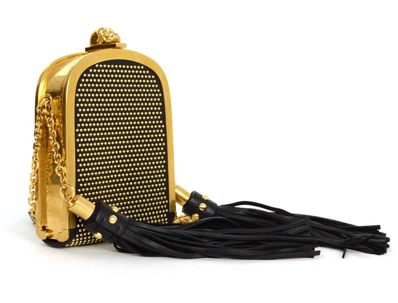 Alexander McQueen Black Leather Gold Studded Tassel & Skull Evening Bag
Features large tassels on either side of bag and iconic McQueen skull with crystal detailing at top opening
Made in: Italy
Color: Black and goldtone
Hardware: