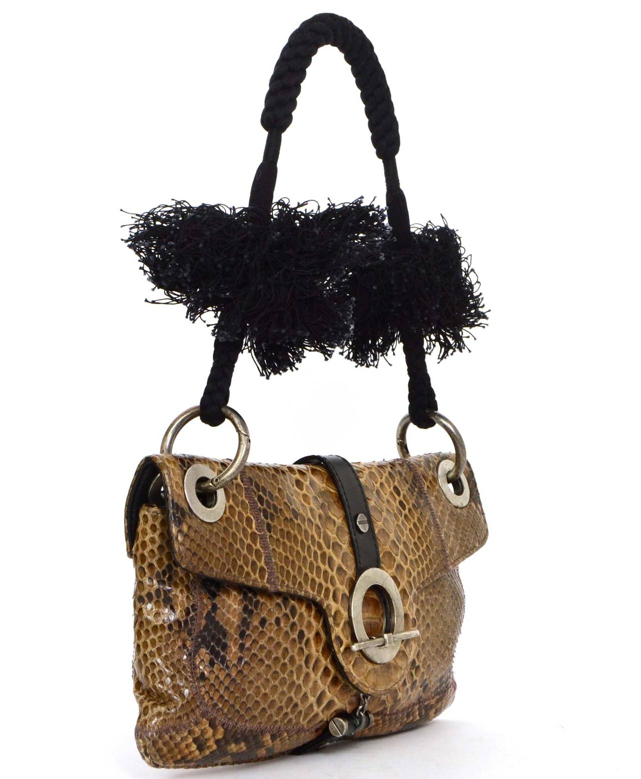 Lanvin Brown Snakeskin Shoulder Bag

Features detachable braided rope & tassel shoulder strap

Color: Brown, tan, black and silvertone
Hardware: Silvertone
Materials: Snakeskin, leather and metal
Lining: Black leather and fine