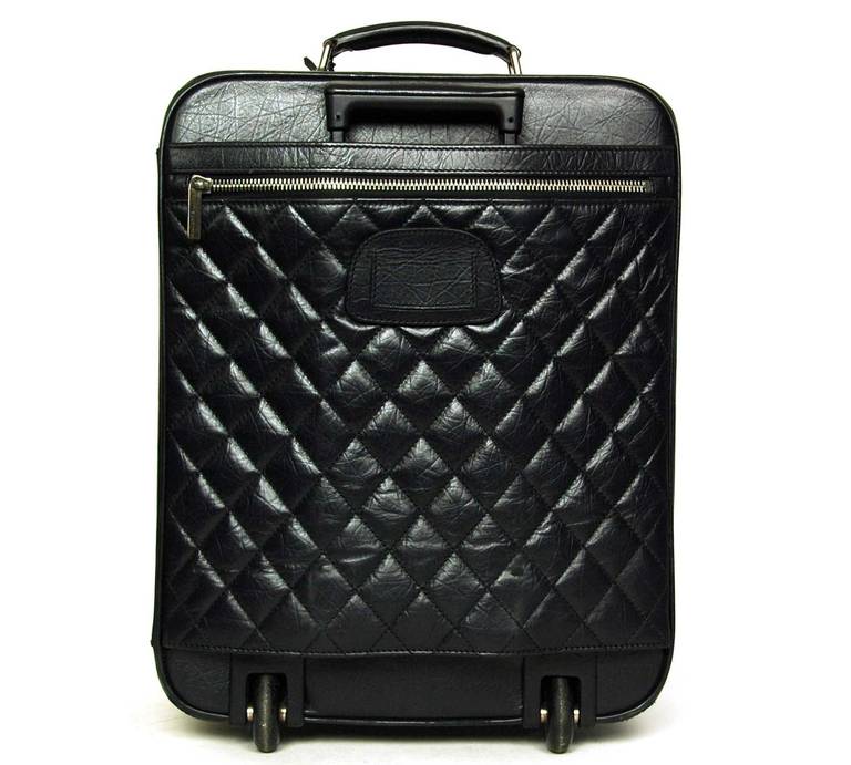 chanel rolling luggage