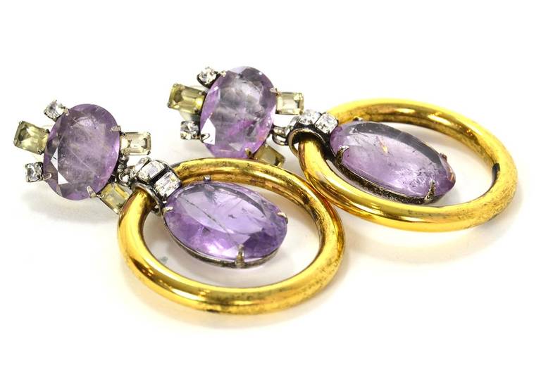 Iradj Moini Amethyst & Gold Hoop Clip On Earrings
Features oval amethyst stone at top clip surrounded by clear rhinestone and yellow baguettes

Stamp: 
