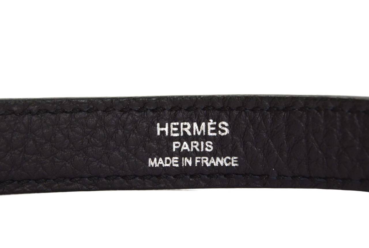 Hermes Indigo Blue Leather Bag Strap
Made In: France
Color: Indigo and silvertone
Hardware: Palladium
Materials: Leather and metal
Closure/Opening: Double sided swivel hook
Stamp: Hermes Paris Made in France
Overall Condition: Excellent-