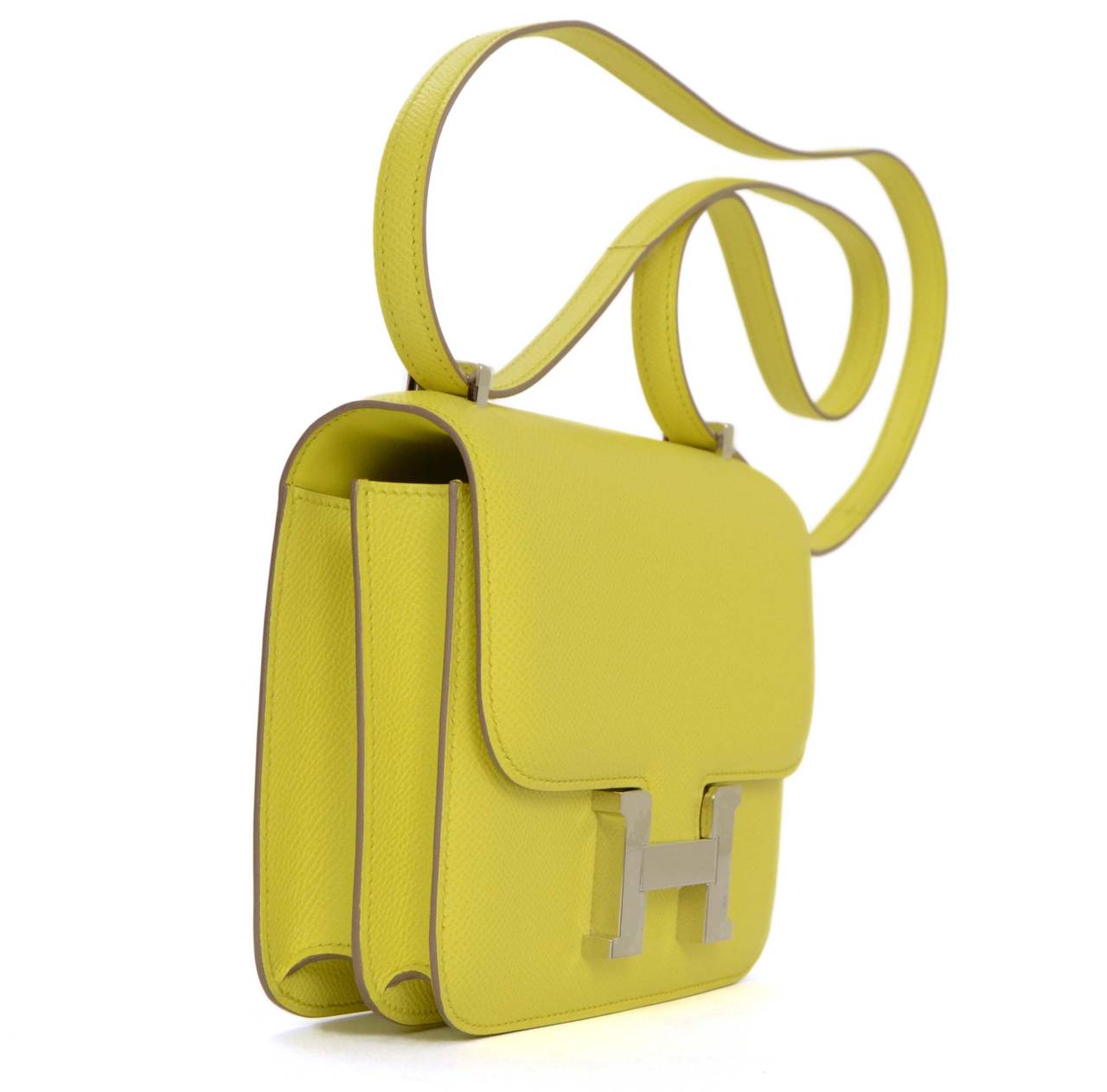 Hermes Soufre Yellow Epsom 18cm H Constance Bag
Features adjustable shoulder strap
Made In: France
Year of Production: 2013
Color: Yellow and silvertone
Hardware: Palladium
Materials: Epsom leather
Lining: Yellow leather
Closure/Opening: